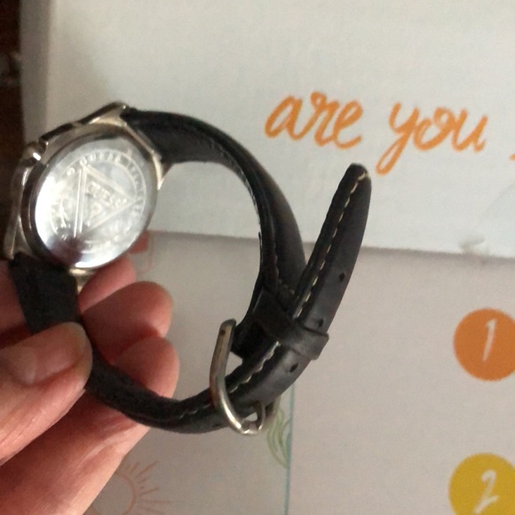 Guess watch with black leather wristband.  Needs a battery. - Picture 2 of 4